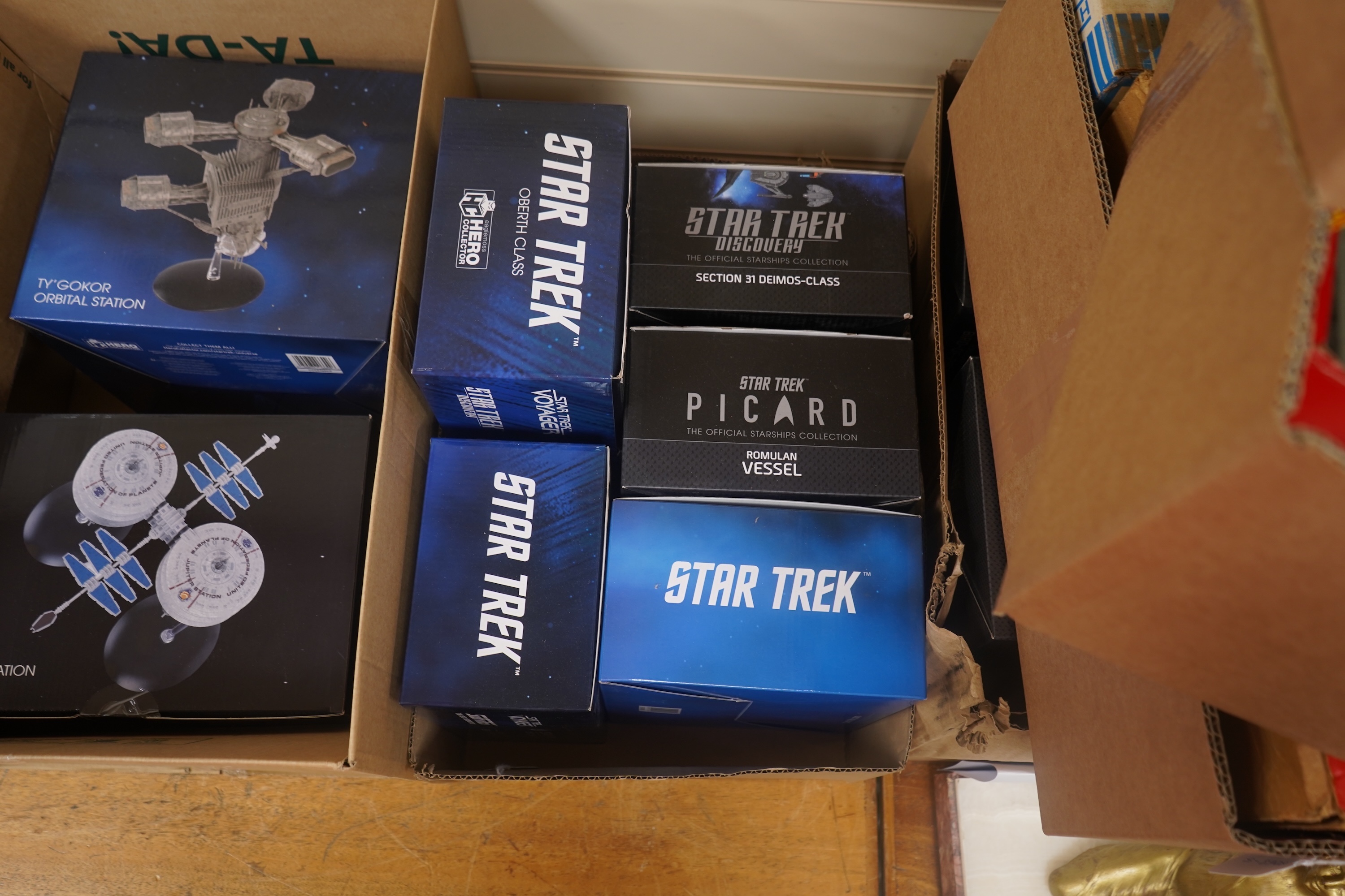 Eighteen boxed Eaglemoss Star Trek magazine issue models, including; a Vulcan Cruiser, a Klingon Qugh Class vessel, a Son’a Battleship, a Romulan Flagship, Jupiter Station, Ty’Gokor Orbital Station, etc. Condition - good